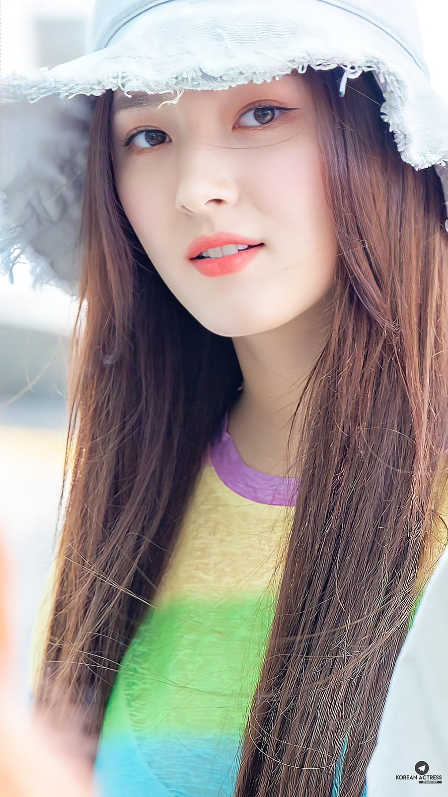 Nancy from Momoland in a white sun hat and colorful striped top HD phone wallpaper