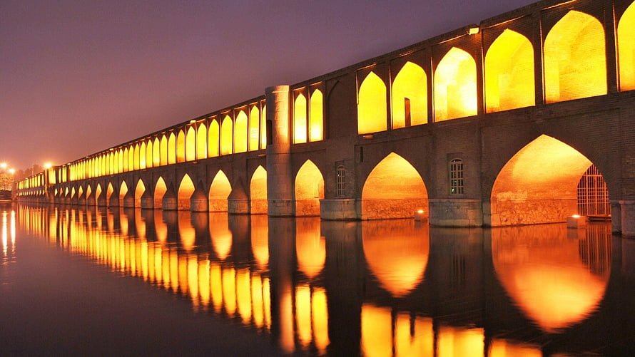 Si-o-se Pol Bridge in Isfahan, Iran, illuminated at night with golden arches reflected in the Zayandeh River HD wallpaper