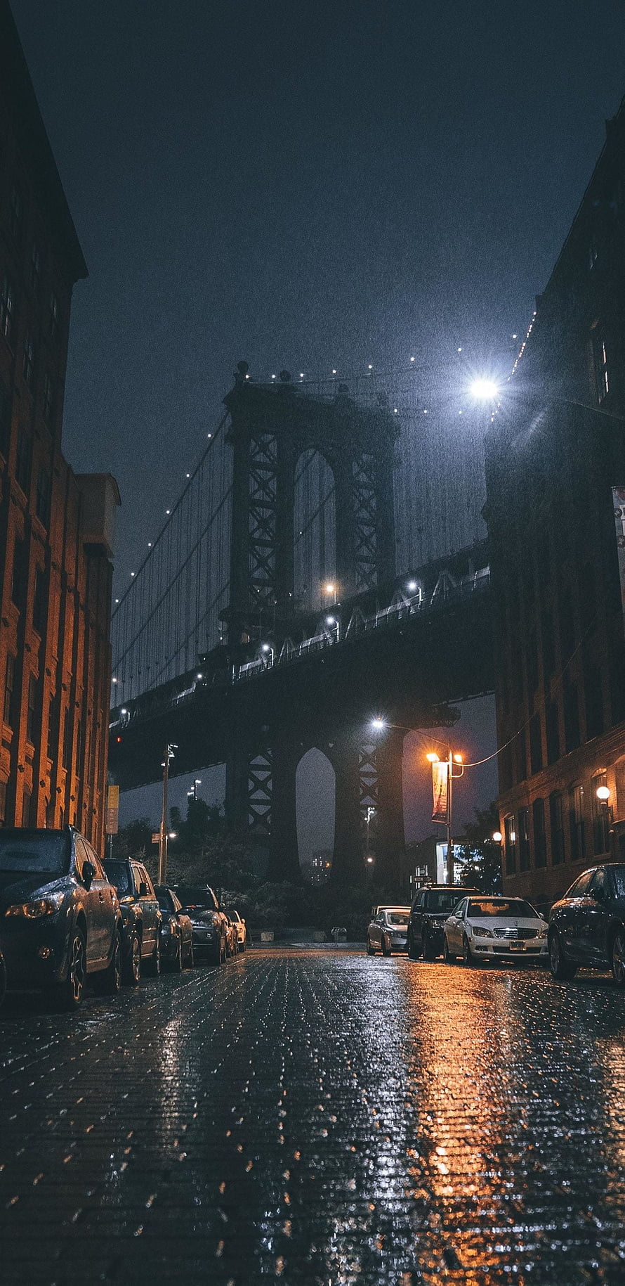 Manhattan Bridge at Night Over Wet Cobblestone Street in New York City HD phone wallpaper