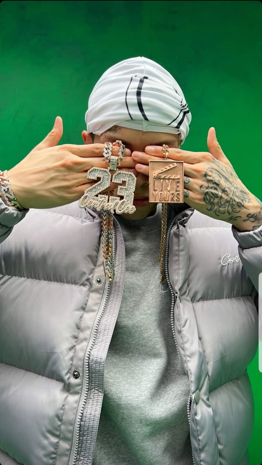 Central Cee in Grey Puffer Jacket Holding Diamond 23 Pendant and Live Yours Clutch HD phone wallpaper