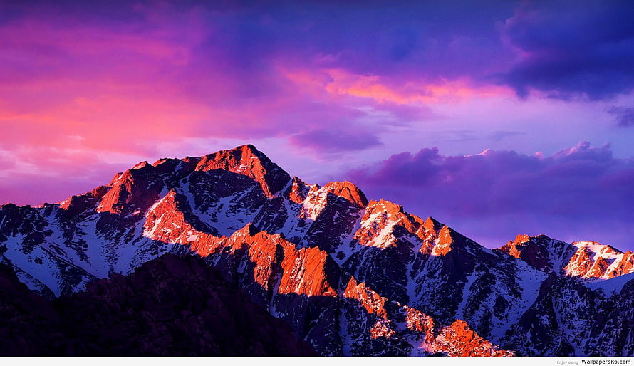 Snow-Capped Mountain Peaks Glowing Under a Vibrant Purple and Pink Sunset Sky HD wallpaper