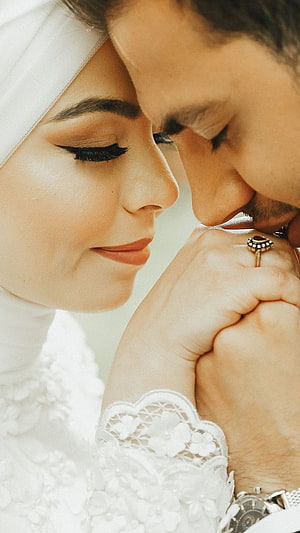 Intimate Muslim Wedding Portrait of Bride and Groom Sharing a Tender Moment HD phone wallpaper