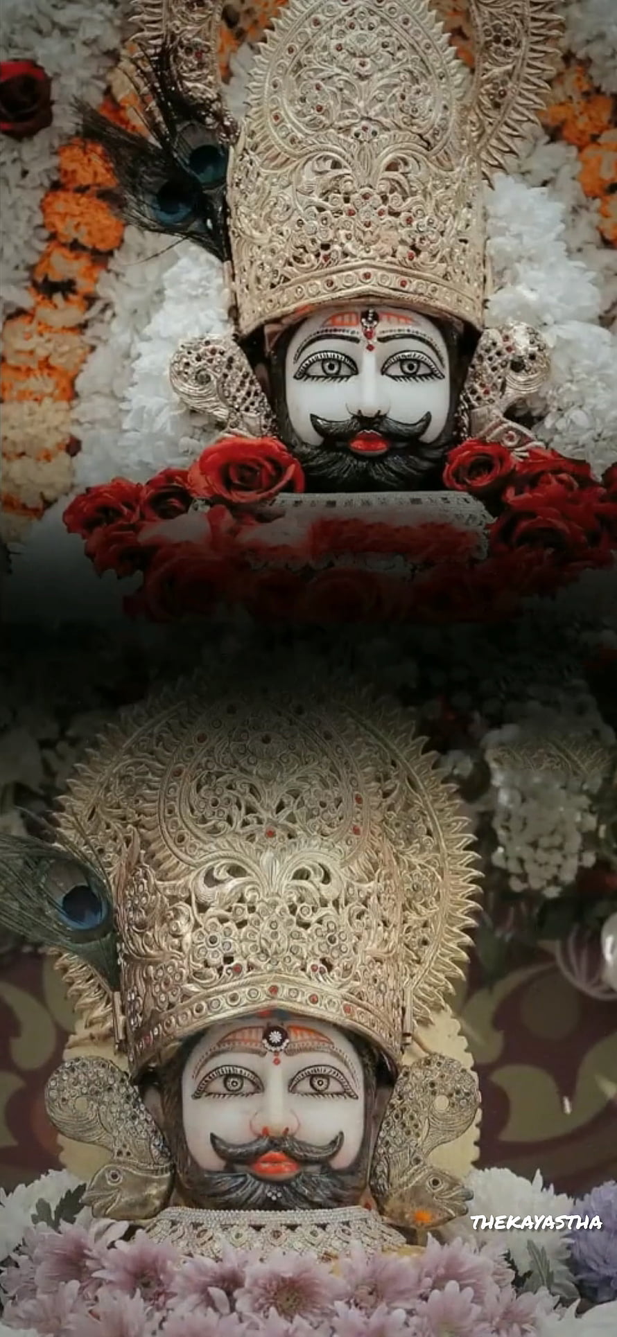 Khatushyam Ji Murti Adorned With Silver Crown, Peacock Feathers, And Fresh Floral Garlands HD phone wallpaper