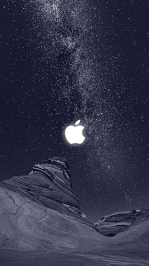 Apple Logo Replacing Moon Above Rocky Mountain Under Starry Night Sky HD phone wallpaper