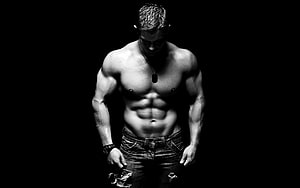 Black and White Portrait of a Muscular Man with Defined Abs and Dog Tags HD wallpaper
