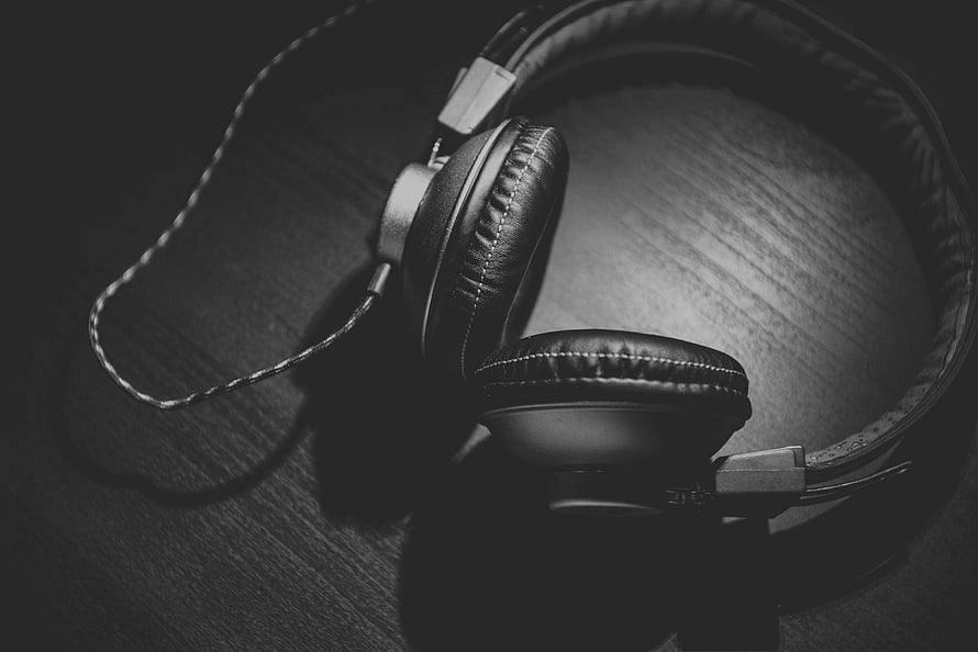 Black and White Over-Ear Headphones on Wooden Surface HD wallpaper