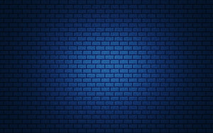 Dark Blue Brick Wall Texture with Soft Central Glow and Vignette Effect HD wallpaper