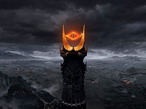 The Eye of Sauron Tower Rising Over a Dark Volcanic Landscape HD wallpaper