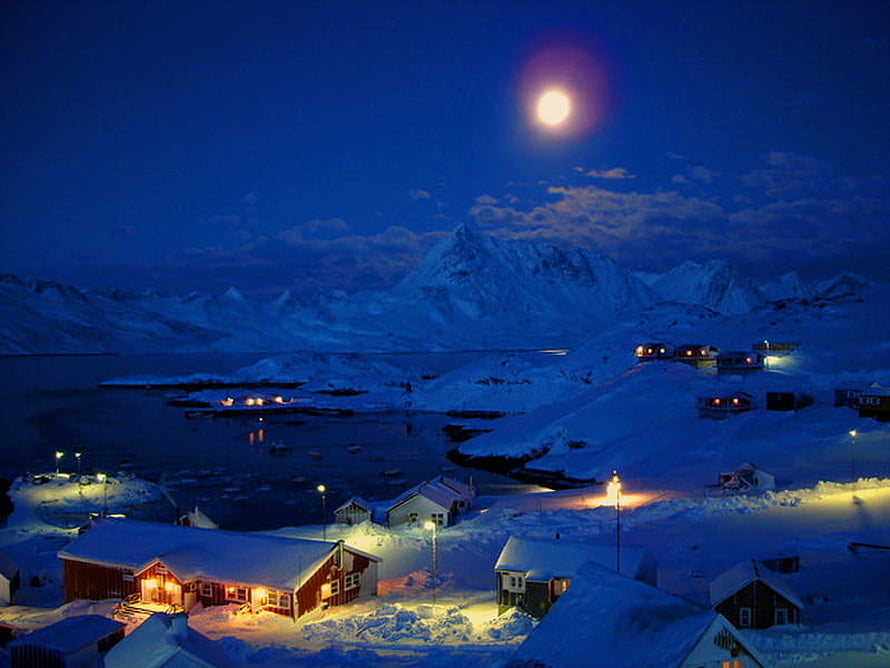 Snowy Arctic Village at Night with Full Moon and Glowing Cabins HD wallpaper