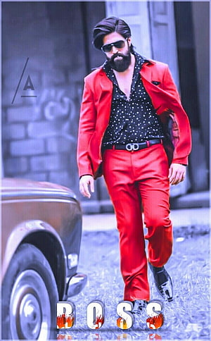 Yash as Rocky Bhai in KGF wearing a bold red suit and sunglasses HD phone wallpaper