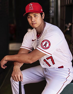 Shohei Ohtani in Los Angeles Angels Home Uniform Sitting in the Dugout HD phone wallpaper