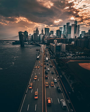 Aerial View of Manhattan Skyline and Brooklyn Bridge at Dusk with Busy FDR Drive Traffic HD phone wallpaper