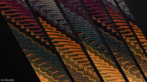 Traditional Indonesian Batik Fabric with Intricate Floral and Geometric Patterns HD wallpaper