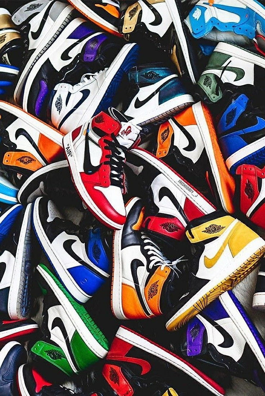 Colorful Air Jordan 1 High Sneakers Collection Displayed in a Vibrant Pile HD phone wallpaper