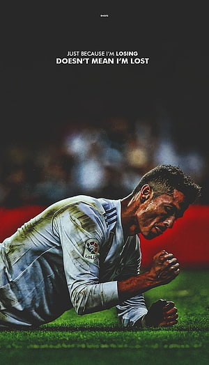 Cristiano Ronaldo Kneeling on the Pitch in Real Madrid Kit with Motivational Quote HD phone wallpaper