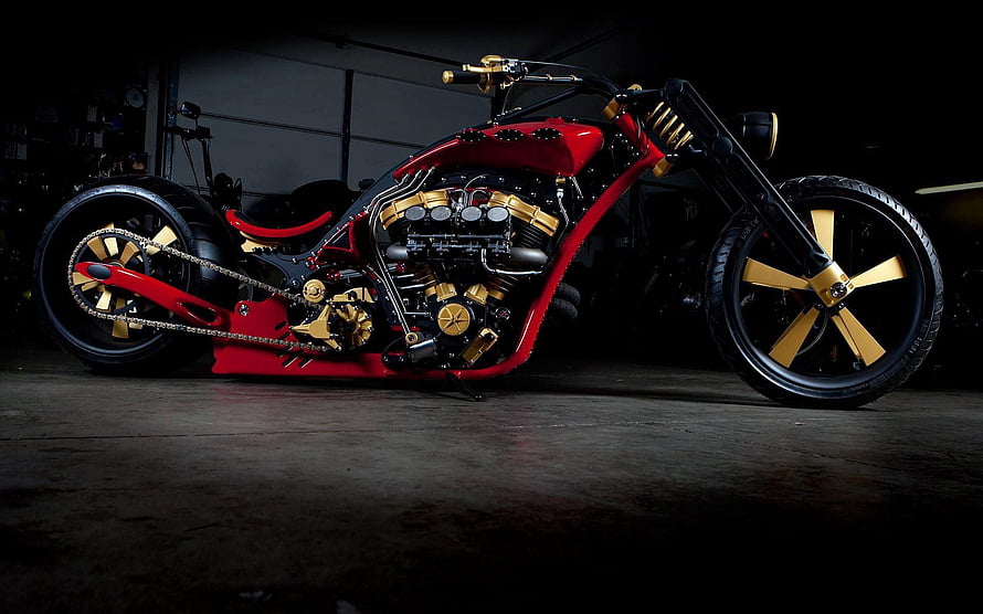 Custom Red and Gold Chopper Motorcycle with Exposed Engine in Dark Garage HD wallpaper