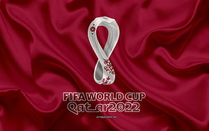 FIFA World Cup Qatar 2022 Official Emblem on Deep Red Silk Fabric Background HD wallpaper
