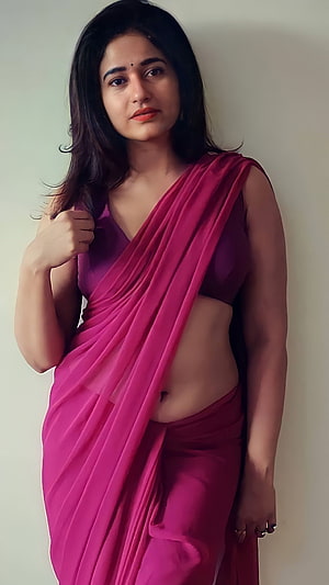 Poonam Bajwa in a vibrant magenta saree with a modern crop top and elegant studio portrait HD phone wallpaper