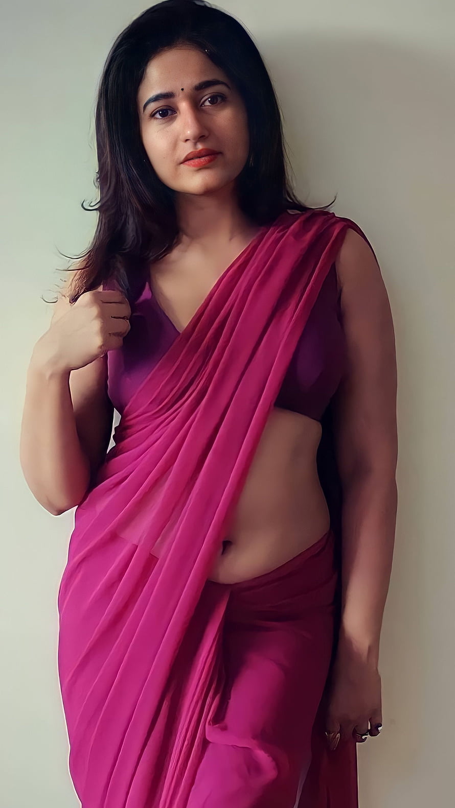 Poonam Bajwa in a vibrant magenta saree with a modern crop top and elegant studio portrait HD phone wallpaper