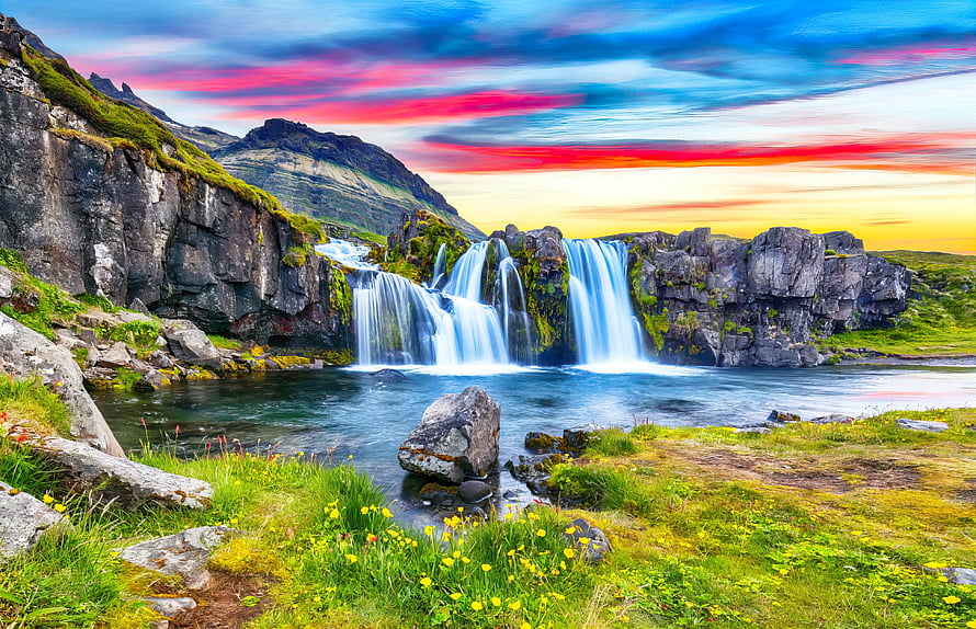 Stjornarfoss Waterfall in Iceland with Vibrant Sunset Sky and Lush Green Meadow HD wallpaper