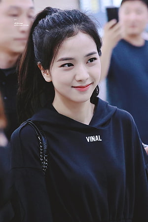 Jisoo from Blackpink in a black VINAL hoodie with a high ponytail and soft smile HD phone wallpaper