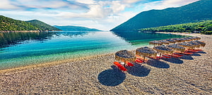 Tropical Beach With Thatched Umbrellas And Turquoise Water HD wallpaper