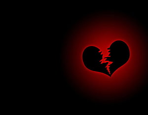 Gothic Broken Heart with Red Glow on Black Background HD wallpaper