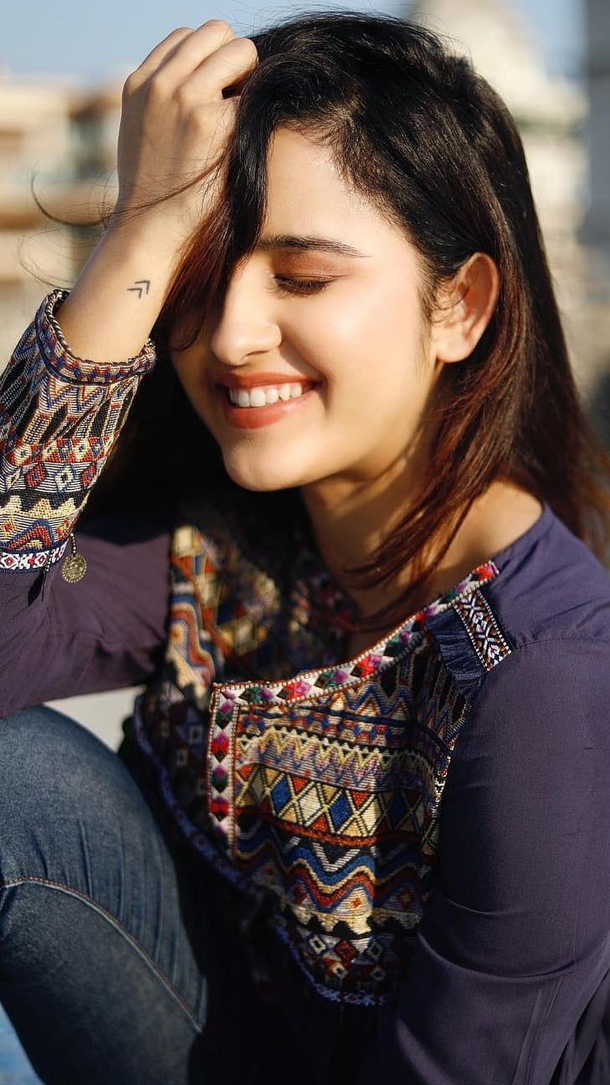 Shirley Setia smiling in colorful embroidered ethnic wear with hand in hair HD phone wallpaper
