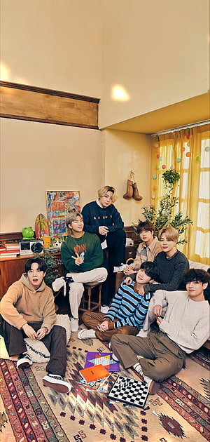 BTS Members Relaxing Together in a Cozy Vintage Living Room with Board Games HD phone wallpaper