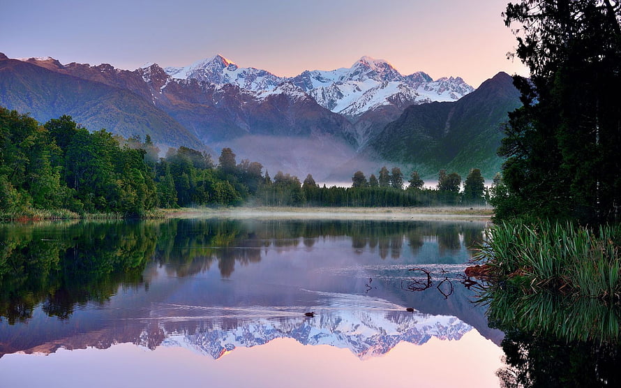 Serene Lake Reflection of Snow-Capped Mountains in New Zealand Spring HD wallpaper
