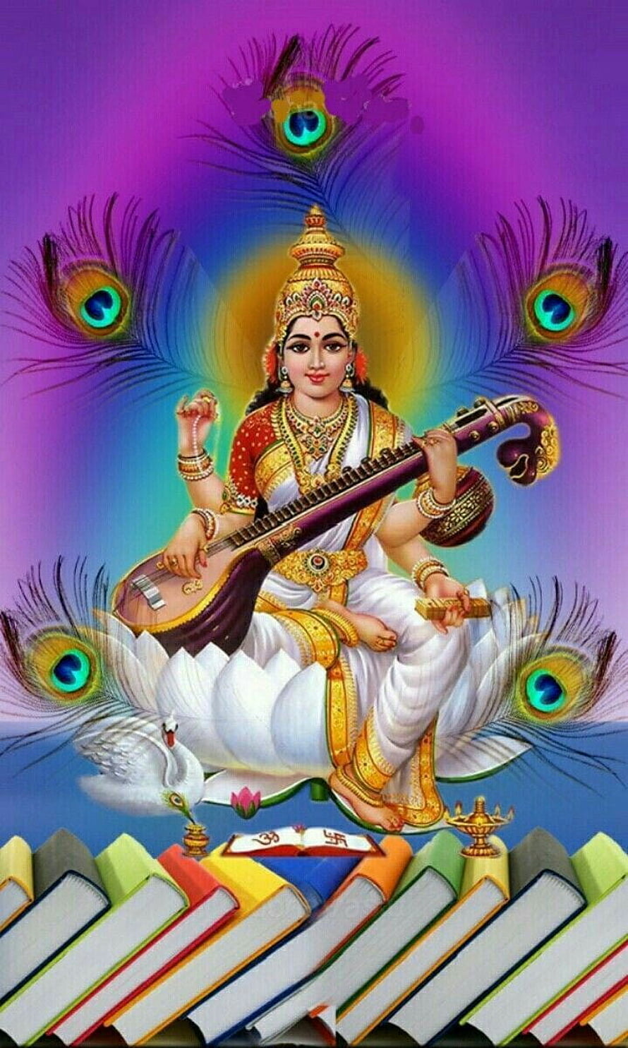 Goddess Saraswati Playing Veena on Lotus with Peacock Feathers and Books HD phone wallpaper