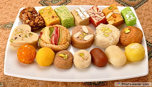 Assorted Indian Mithai Sweets Platter with Nuts and Pistachios HD wallpaper