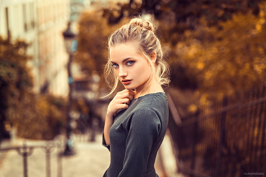Blonde Woman in Dark Dress with Autumn City Background HD wallpaper