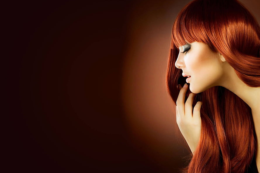 Elegant Profile Portrait of a Woman with Long Red Hair and Dramatic Makeup HD wallpaper