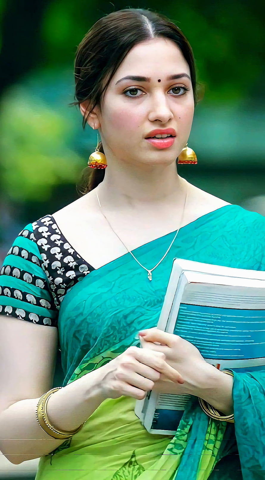 Tamanna Bhatia in a teal and green sari holding books with gold jewelry HD phone wallpaper