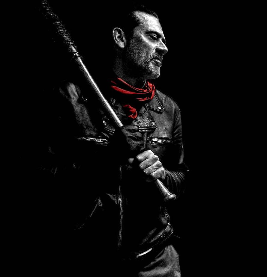 Negan from The Walking Dead in a black leather jacket with a red scarf holding a weapon HD phone wallpaper