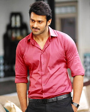 Prabhas in a red button-down shirt with rolled sleeves and black trousers HD phone wallpaper