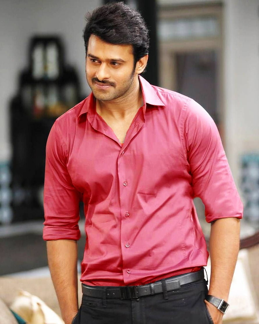 Prabhas in a red button-down shirt with rolled sleeves and black trousers HD phone wallpaper