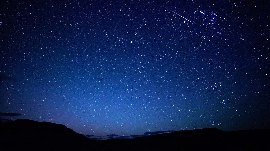 Starry Night Sky Over Silhouetted Mountains With Shooting Star HD wallpaper