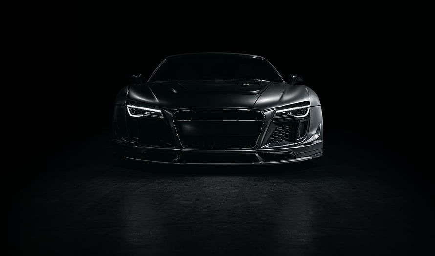 Audi R8 Front View in Dark Studio Setting with Dramatic Lighting HD wallpaper