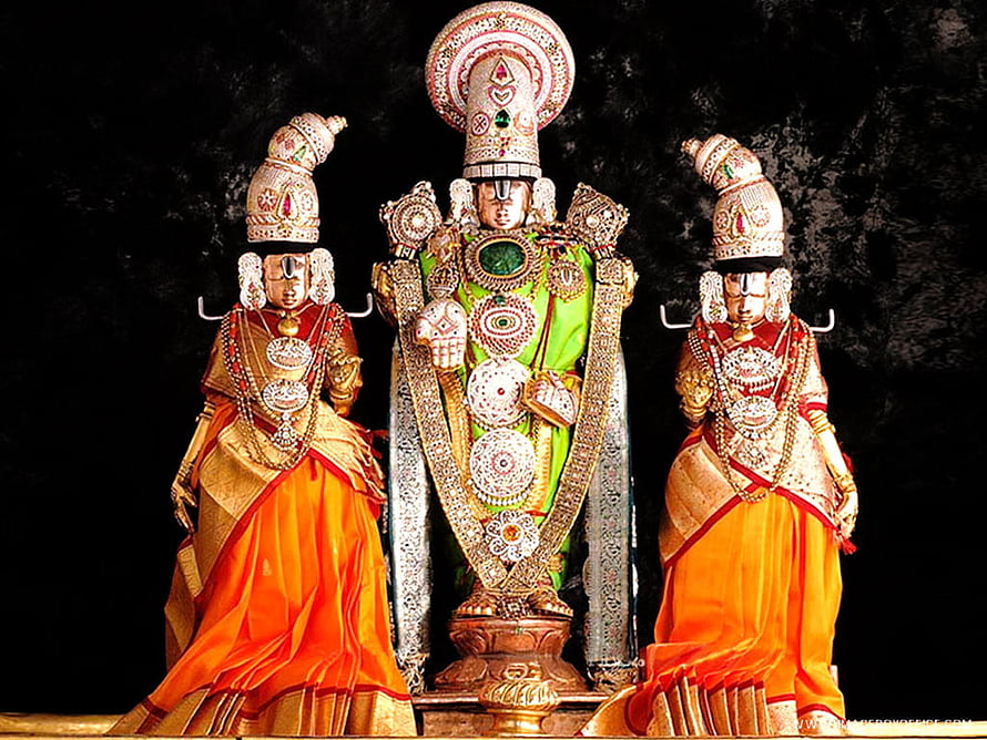 Lord Venkateswara Swamy with consorts in ornate temple attire and traditional jewelry HD wallpaper
