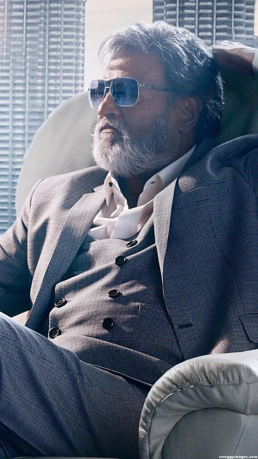 Rajinikanth as Kabali in a grey three-piece suit with aviator sunglasses HD phone wallpaper