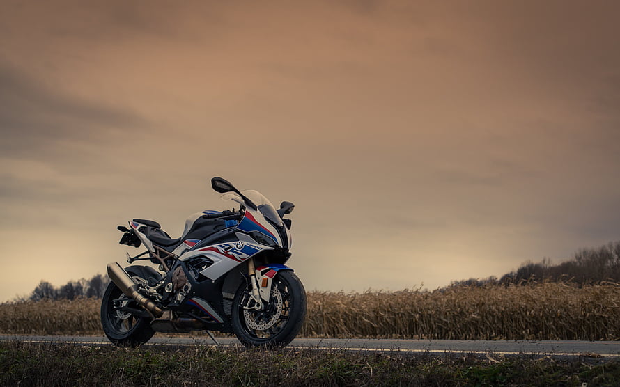 BMW S1000RR Sport Bike Parked on Rural Road at Golden Hour Sunset HD wallpaper