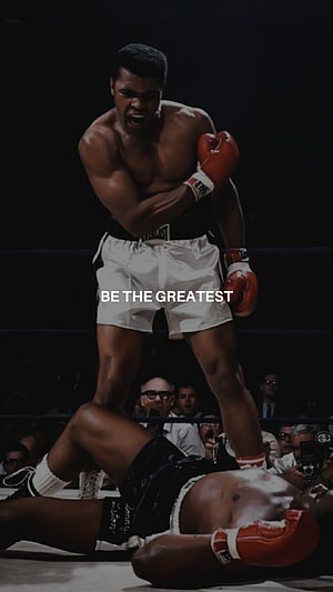 Muhammad Ali Standing Over Fallen Opponent in Classic Boxing Match HD phone wallpaper