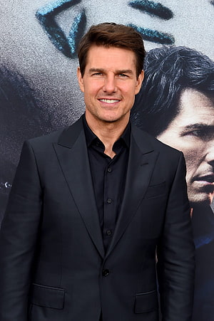 Tom Cruise in a black suit at a Mission Impossible premiere event HD phone wallpaper