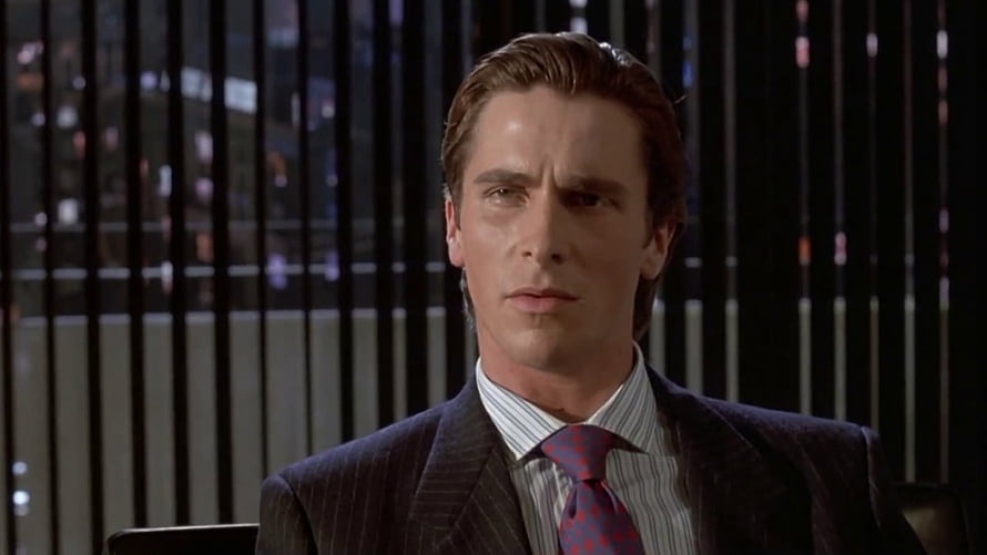 Patrick Bateman in a dark pinstripe suit from the film American Psycho HD wallpaper