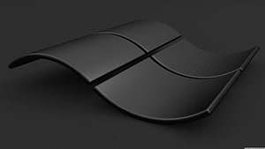 Sleek Black Curved Abstract Sculpture on Dark Background HD wallpaper