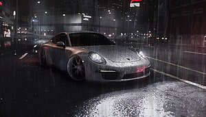 Silver Porsche 911 sports car parked on a wet city street at night in the rain HD wallpaper