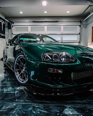 Deep Green Toyota Supra MK4 A80 JDM Coupe in Modern Garage HD phone wallpaper