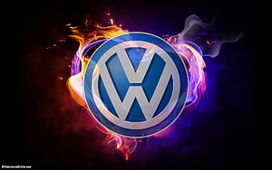 Volkswagen emblem surrounded by vibrant neon flames and swirling smoke on a dark background HD wallpaper